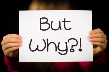 Child holding Why sign