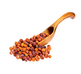 Dry rowan on the wooden spoon.