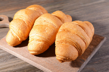 Delicious croissants on table close-up