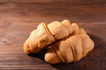 Delicious croissants on table close-up