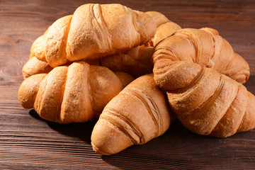 Delicious croissants on table close-up