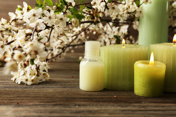 Spa still life with flowering branches on wooden table, closeup