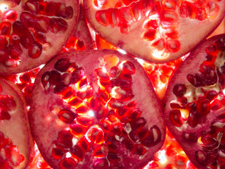 pomegranate slices lit from below