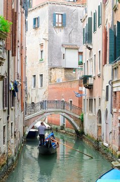 Venetian Channel with gondola and small bridge