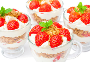 homemade desert with cream chopped cookies and fresh strawberry