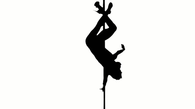 one caucasian woman pole dancer dancing in silhouette studio
