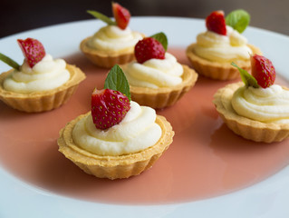 Tiny cupcakes with strawberry, whipped cream