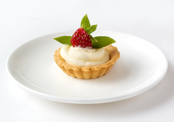 Tiny cupcake with strawberry, whipped cream and mint 