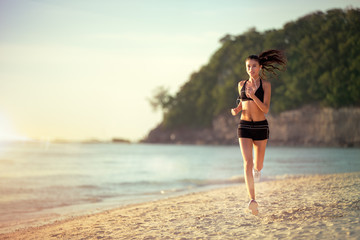 woman running on the beach