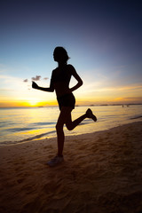 Fototapeta na wymiar Silhouette of running woman