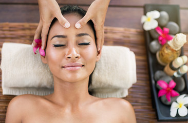 young woman receiving facial massage