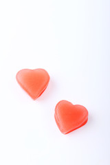 two red heart-shaped ice from raspberry syrup