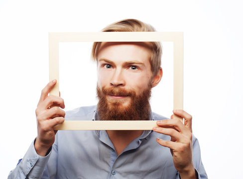 Young Man Holding Picture Frame