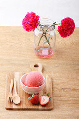 red homemade strawberry ice cream scoop with fresh strawberry