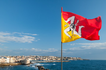 Flag of Sicily in the seafront of Ortigia, Syracuse