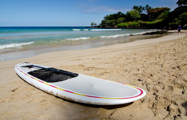 Forgotten surfboard at Mauna Kea Beach