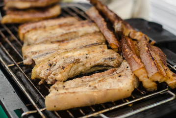 grilling pork in  market .