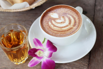 Hot latte coffee and hot tea with toast.