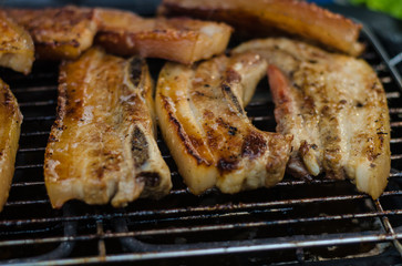 grilling pork in  market .