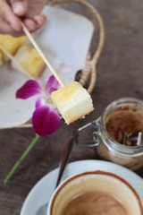Toast with hot coffee latte in a glass.