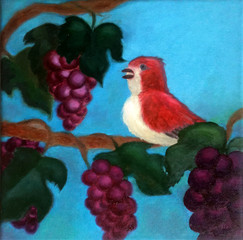 Red bird on grapevine with grapefruits