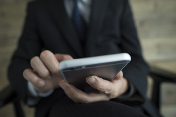 Businessmen are using the latest smartphone