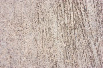 Cement floors are old and dirty.