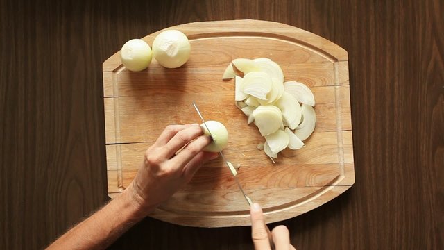 Chef chopping onions; closeup; 
