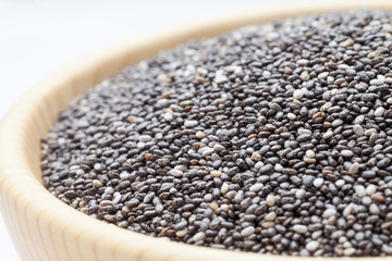 Chia seeds in wooden bowl