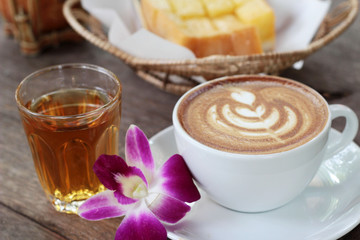 Hot latte coffee and hot tea with toast.