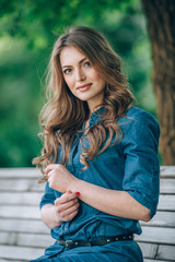 Naklejka premium portrait of a beautiful blonde outdoors in the park