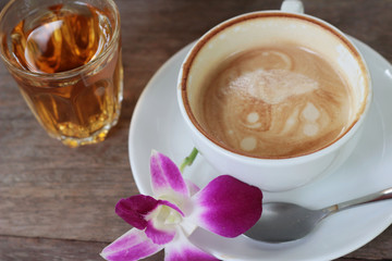 Hot latte coffee and hot tea with toast.