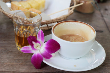 Hot latte coffee and hot tea with toast.