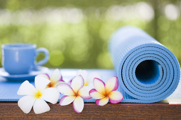 yoga mat and a cup of coffee