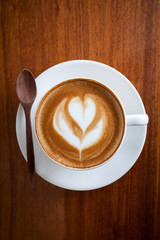 A cup of coffee latte with spoon