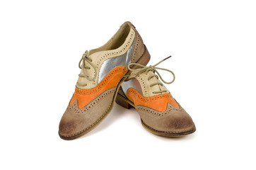 Beautiful brown and orange woman shoes isolated on white backgro