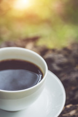 White coffee cup in the park