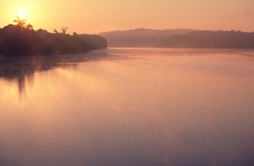 Foggy sunrise on the lake