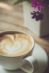 White coffee cup on the table at morning time