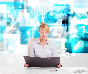 Business person at desk with modern tech images at background