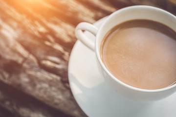 White coffee cup in the garden