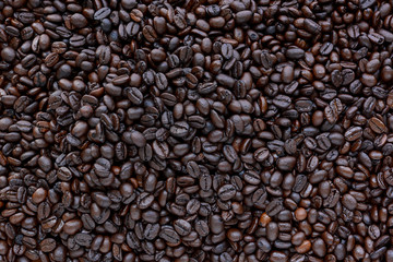 Dark roasted coffee beans as background