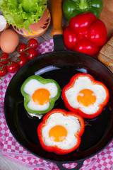 Fried eggs in peppers