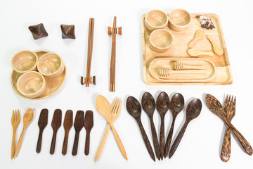 Wooden kitchen utensils on white background