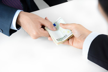 Businessman hands giving & receiving money, Euro currency (EUR)