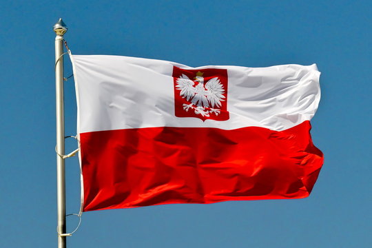 Polish national flag in the sky.