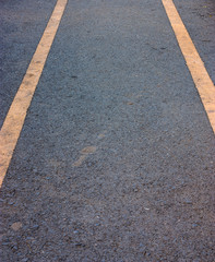 Asphalt road with yellow lines