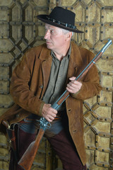 Mature male bandit with gun 