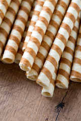 waffle rolls on wooden surface