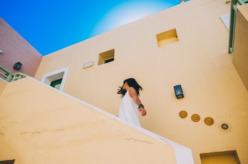 girl walking on stairs in hotel room